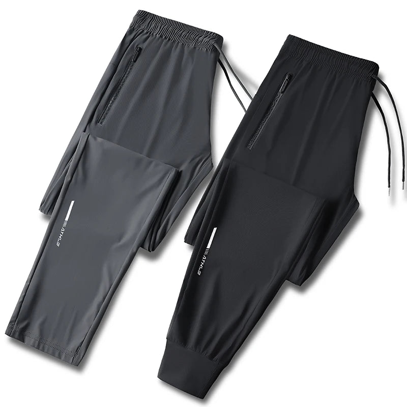 Men's solid color pants summer ice silk elastic quick drying loose sports pants suitable for casual and business wear M-8XL