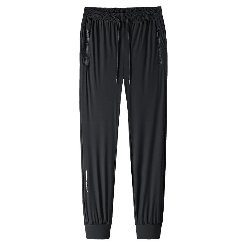 Men's solid color pants summer ice silk elastic quick drying loose sports pants suitable for casual and business wear M-8XL